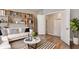 Cozy living room featuring stylish built-in shelving, hardwood floors, and a neutral color palette at 1300 Winfair Ne Ln, Brookhaven, GA 30329