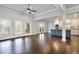 Expansive living space showcasing hardwood floors and an open layout connecting the kitchen and living areas at 1300 Winfair Ne Ln, Brookhaven, GA 30329