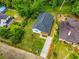 An aerial view of a well-maintained home with a large yard and a new driveway in a lush neighborhood at 1317 Bernard Nw St, Atlanta, GA 30314