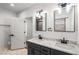 A spacious bathroom featuring a double vanity and hex tile flooring at 1317 Bernard Nw St, Atlanta, GA 30314