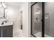 Modern bathroom featuring a sleek glass shower and double vanity at 1317 Bernard Nw St, Atlanta, GA 30314