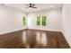 A spacious bedroom with a ceiling fan and windows providing natural light at 1317 Bernard Nw St, Atlanta, GA 30314