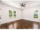 A spacious bedroom with dark wood floors and large windows at 1317 Bernard Nw St, Atlanta, GA 30314