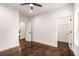 A bright bedroom with dark wood floors and a modern ceiling fan at 1317 Bernard Nw St, Atlanta, GA 30314