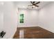 Bright bedroom featuring hardwood floors, a ceiling fan, and natural light from the window at 1317 Bernard Nw St, Atlanta, GA 30314