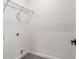 A walk-in closet space with wood laminate flooring and white walls at 1317 Bernard Nw St, Atlanta, GA 30314