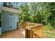Wooden deck featuring a wooden railing and a view of a lush green yard at 1317 Bernard Nw St, Atlanta, GA 30314