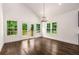 Dining area with hardwood floors, natural light, and access to outdoor deck at 1317 Bernard Nw St, Atlanta, GA 30314
