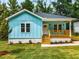 Charming light blue bungalow with a cozy front porch and newly landscaped front yard at 1317 Bernard Nw St, Atlanta, GA 30314