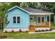 Charming light blue bungalow with a cozy front porch and newly landscaped front yard at 1317 Bernard Nw St, Atlanta, GA 30314