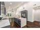 Spacious kitchen with center island, stainless steel refrigerator, and open layout to the dining area at 1317 Bernard Nw St, Atlanta, GA 30314