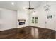 Bright living room features high ceilings, modern fireplace, and hardwood floors at 1317 Bernard Nw St, Atlanta, GA 30314