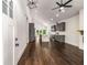 Open-concept living space with hardwood floors, modern light fixture, and fireplace at 1317 Bernard Nw St, Atlanta, GA 30314
