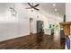 Open-concept living area with hardwood floors, vaulted ceilings, and modern lighting fixtures at 1317 Bernard Nw St, Atlanta, GA 30314