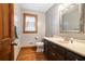 Bright bathroom featuring a vanity, tile flooring, and wooden trim at 3392 Inns Brook Way, Snellville, GA 30039