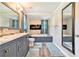 Bathroom with dual vanity, soaking tub, electric fireplace and modern fixtures at 3392 Inns Brook Way, Snellville, GA 30039