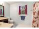 Cozy bathroom featuring bright natural light, a vanity, and a shower with patterned curtain at 3392 Inns Brook Way, Snellville, GA 30039