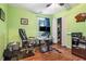 Lime green bedroom featuring wood floors, closet and computer setup perfect for an office at 3392 Inns Brook Way, Snellville, GA 30039