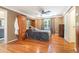 Bedroom featuring hardwood floors, natural light, and wooden furniture at 3392 Inns Brook Way, Snellville, GA 30039