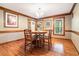 Charming dining room with wood floors and trim, perfect for Gathering meals and entertaining at 3392 Inns Brook Way, Snellville, GA 30039