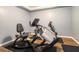 The exercise room features two stationary bikes with padded seats and wood-look flooring at 3392 Inns Brook Way, Snellville, GA 30039