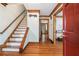 Inviting foyer with hardwood floors, staircase, and trim, offering a warm welcome at 3392 Inns Brook Way, Snellville, GA 30039