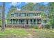 Charming two-story home with a welcoming front porch and well-maintained landscaping at 3392 Inns Brook Way, Snellville, GA 30039