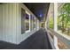 Inviting front porch with a swing, perfect for relaxing and enjoying the outdoors at 3392 Inns Brook Way, Snellville, GA 30039