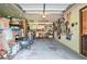 Well-organized garage with storage shelves, tools, and ample space for vehicles at 3392 Inns Brook Way, Snellville, GA 30039