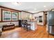 Eat-in kitchen featuring an island and modern stainless steel appliances at 3392 Inns Brook Way, Snellville, GA 30039
