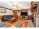 Comfortable living room with fireplace, hardwood floors, and natural light at 3392 Inns Brook Way, Snellville, GA 30039