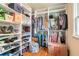 Spacious walk-in closet with custom shelving and ample storage for clothes, shoes, and accessories at 3392 Inns Brook Way, Snellville, GA 30039