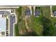 Aerial view showing the home with adjacent vacant land at 380 South St, Buford, GA 30518