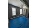 Bedroom featuring two large windows and a closet with an open door at 380 South St, Buford, GA 30518