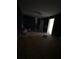 Unfinished bedroom featuring dark walls, ceiling fan, and door to another room at 380 South St, Buford, GA 30518