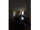 Darkly lit dining area connecting to the kitchen space at 380 South St, Buford, GA 30518