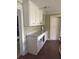 Kitchen area with modern white cabinets and neutral granite counters at 380 South St, Buford, GA 30518
