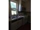 Updated kitchen featuring stainless steel sink and appliances, plus natural light at 380 South St, Buford, GA 30518