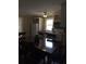Cozy kitchen and eating area with wooden table, white appliances, and a bright window at 380 South St, Buford, GA 30518