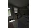 Functional laundry area with washer, shelving, a utility sink, and natural light at 380 South St, Buford, GA 30518