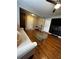 The living room features hardwood floors, neutral paint, a ceiling fan, and modern decor at 380 South St, Buford, GA 30518