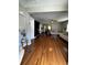 Spacious living room with hardwood floors, neutral paint, a ceiling fan, and plenty of natural light at 380 South St, Buford, GA 30518