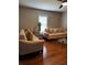 The living room boasts hardwood floors, neutral paint, and bright natural light at 380 South St, Buford, GA 30518