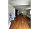 Spacious living room featuring hardwood floors, neutral paint, ceiling fan, and open floorplan at 380 South St, Buford, GA 30518