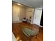 Cozy living room featuring hardwood floors and a glass coffee table at 380 South St, Buford, GA 30518