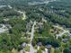 Aerial view of a home nestled among trees in a residential community at 858 Red Rock Ct, Suwanee, GA 30024