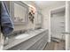 Bathroom boasts double sinks, granite countertops, decorative mirrors, and a shower at 858 Red Rock Ct, Suwanee, GA 30024