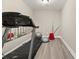A compact gym space with a treadmill, exercise ball, and mirrored wall at 858 Red Rock Ct, Suwanee, GA 30024