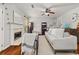 Comfortable living room featuring hardwood floors, a fireplace, and stylish decor at 858 Red Rock Ct, Suwanee, GA 30024