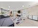 Open floor plan showcases a gray sofa, entertainment center, and a modern rug design at 858 Red Rock Ct, Suwanee, GA 30024